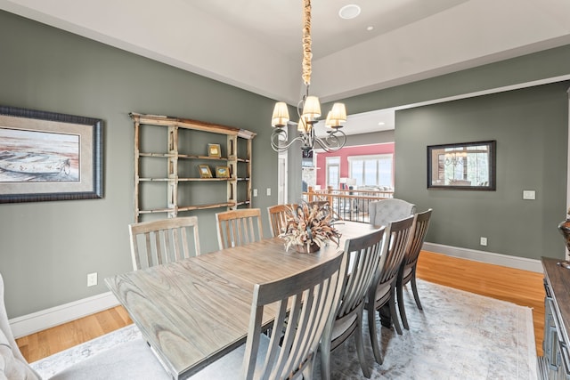 dining space featuring a chandelier and hardwood / wood-style floors