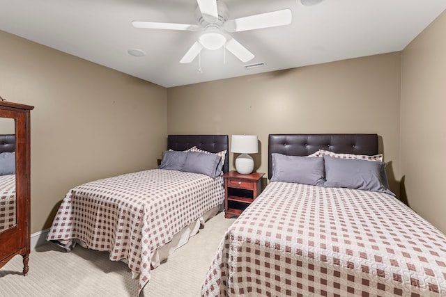 bedroom featuring ceiling fan and light carpet