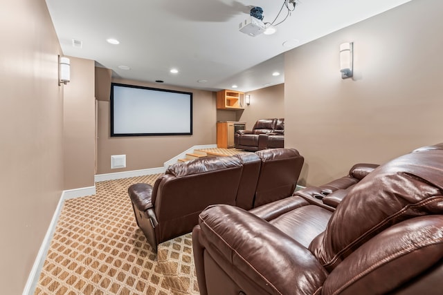 cinema room with light colored carpet