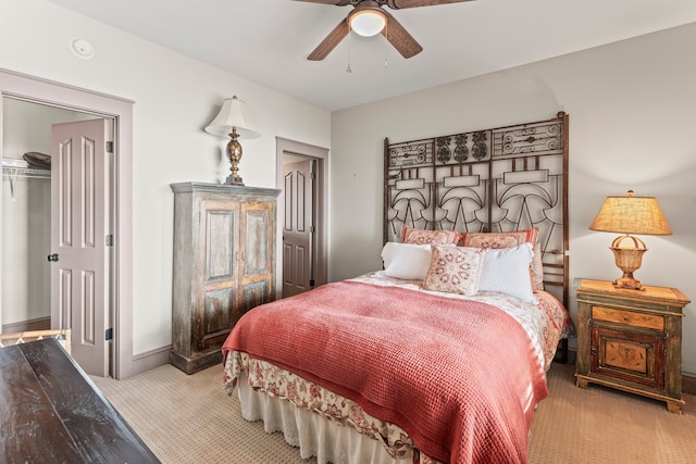 carpeted bedroom featuring a closet and ceiling fan