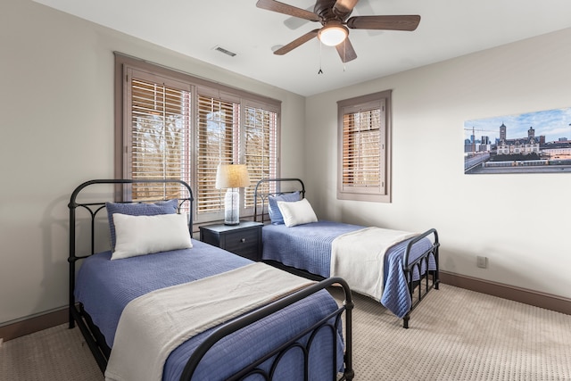 bedroom with ceiling fan and carpet floors