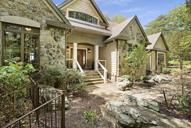 property entrance with covered porch