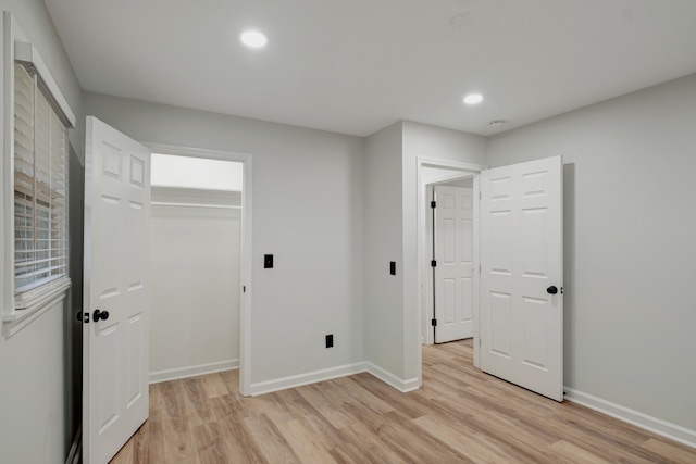 interior space featuring a closet and light wood-type flooring