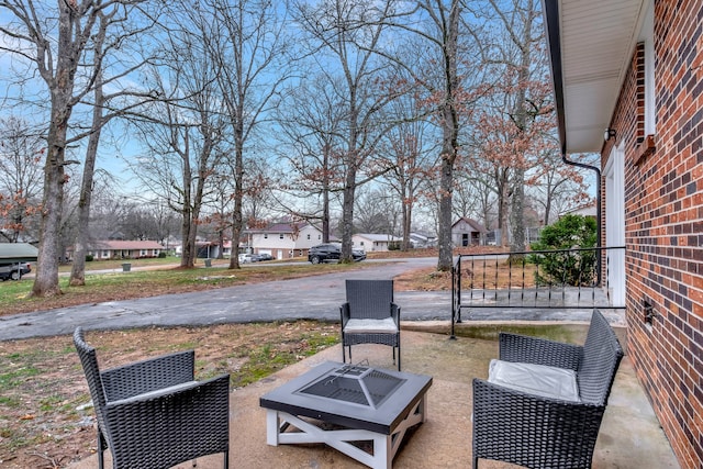 view of patio with an outdoor fire pit