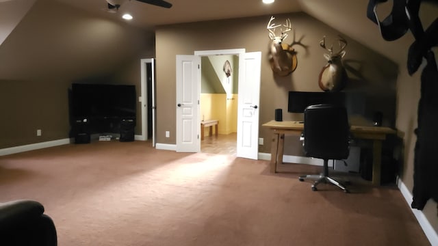 carpeted home office with ceiling fan and lofted ceiling