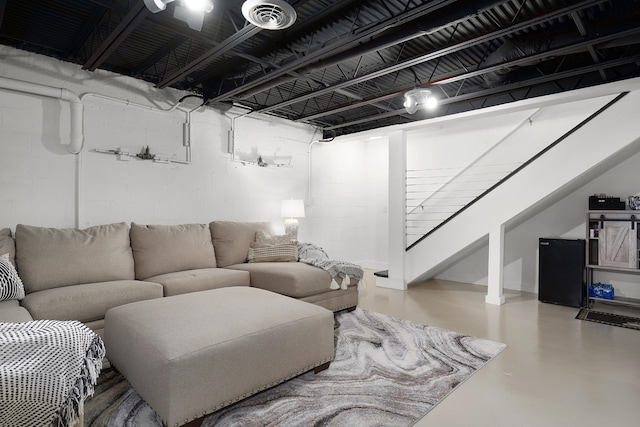 living room featuring concrete flooring