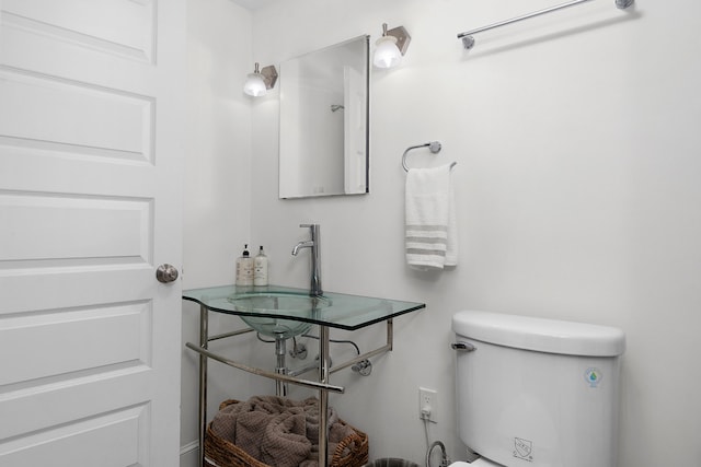 bathroom featuring sink and toilet