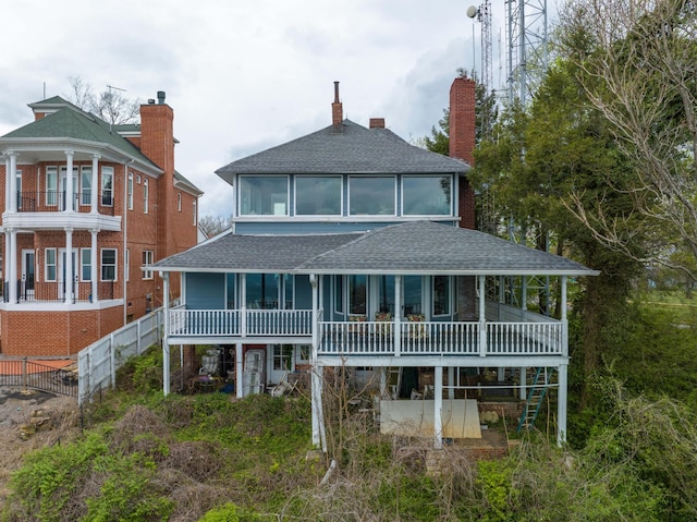 rear view of property with a balcony