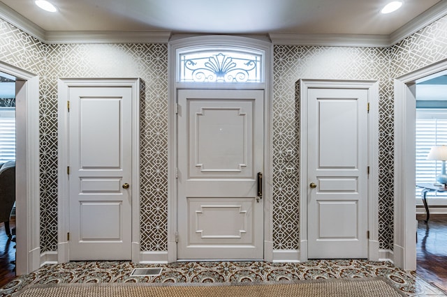 entryway featuring hardwood / wood-style floors and ornamental molding