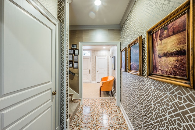 corridor featuring light tile floors and crown molding