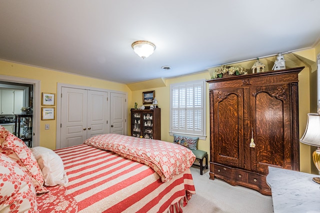 bedroom with light colored carpet