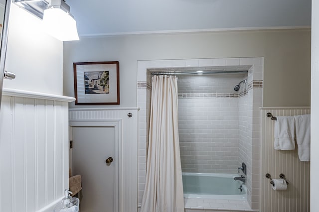 bathroom featuring shower / tub combo with curtain and ornamental molding