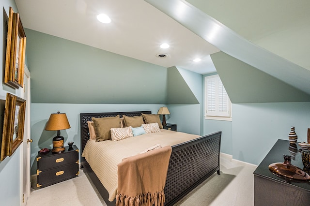 carpeted bedroom featuring vaulted ceiling