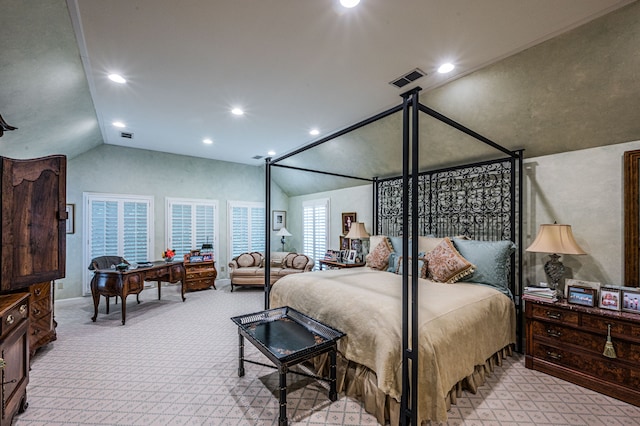 bedroom with light carpet and vaulted ceiling