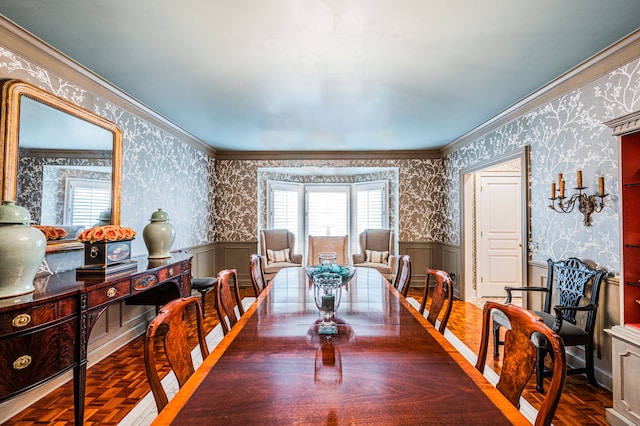 dining room with dark parquet floors and ornamental molding