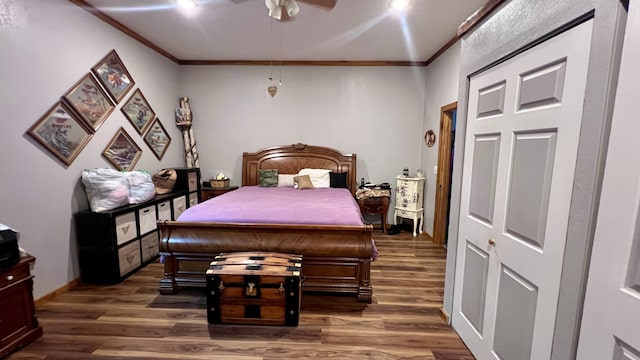 bedroom with ceiling fan, crown molding, and dark hardwood / wood-style flooring