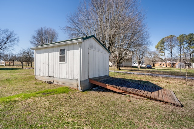 view of shed / structure featuring a lawn
