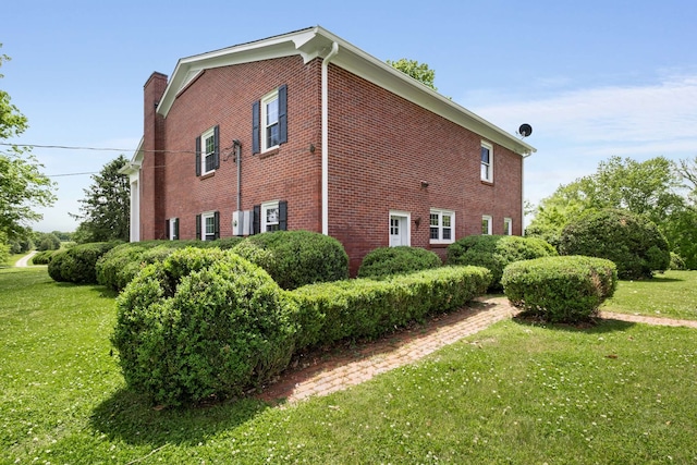 view of home's exterior featuring a yard