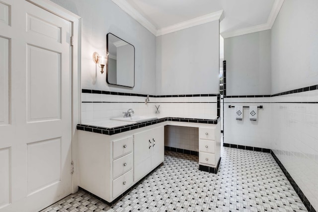 bathroom with vanity, ornamental molding, and tile walls