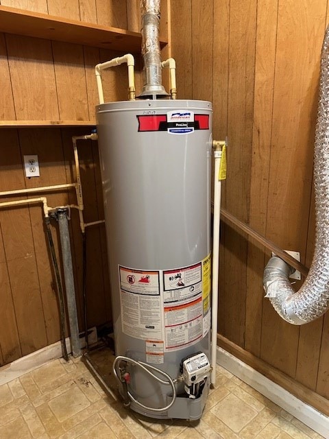 utility room featuring gas water heater