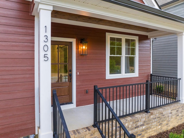 property entrance featuring covered porch