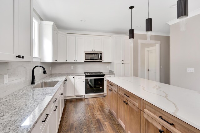 kitchen featuring white cabinetry, dark hardwood / wood-style floors, sink, and stainless steel appliances