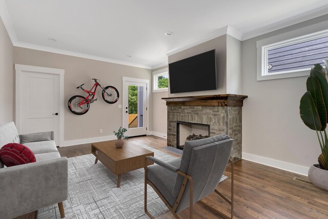 living room with ornamental molding and wood-type flooring