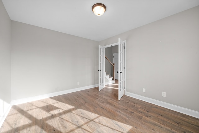 spare room with hardwood / wood-style flooring