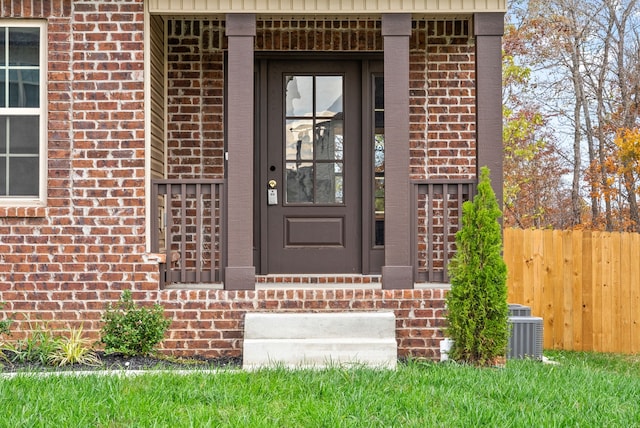 doorway to property with central AC unit