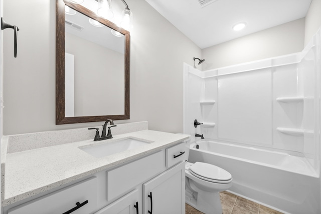 full bathroom featuring tile patterned floors, toilet, vanity, and tub / shower combination