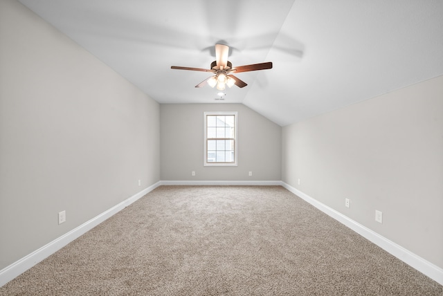 bonus room with carpet flooring, vaulted ceiling, and ceiling fan