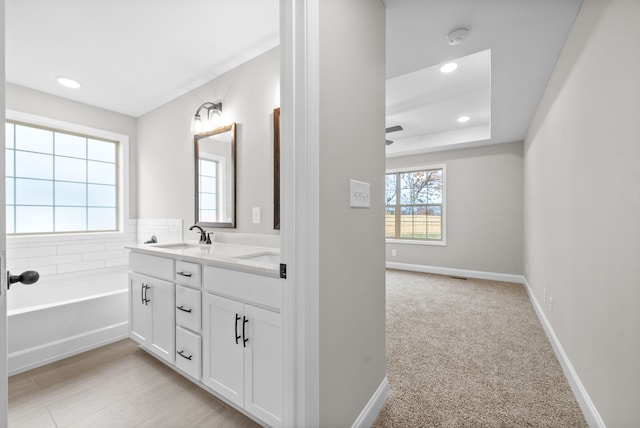 bathroom featuring a bathing tub and vanity