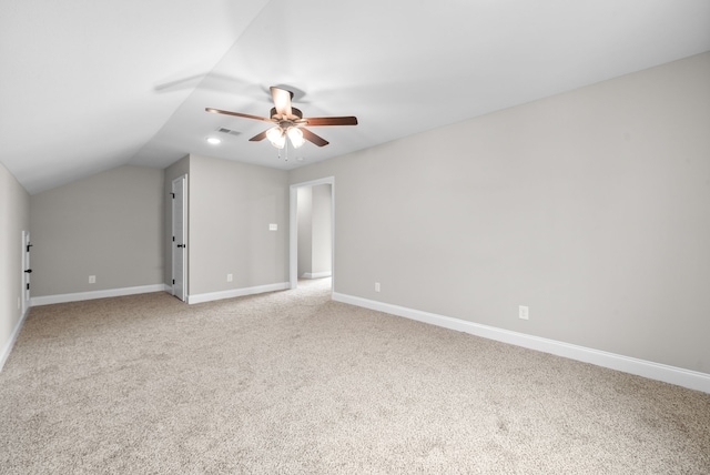 additional living space with ceiling fan, light carpet, and vaulted ceiling