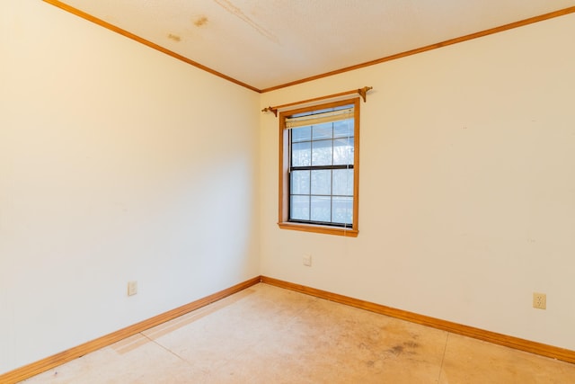 spare room with crown molding and a textured ceiling