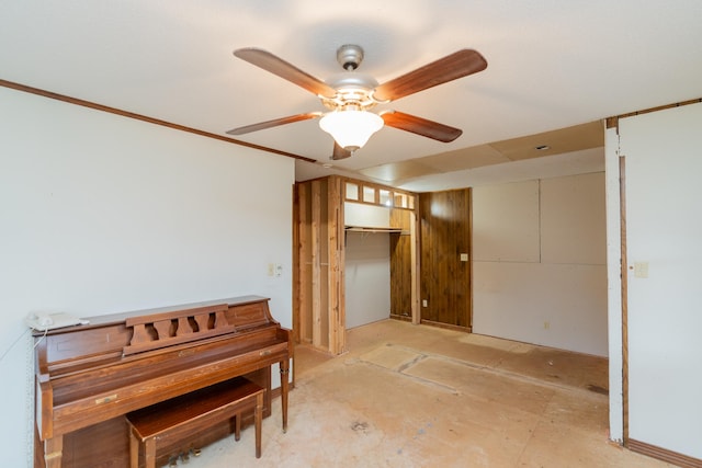 misc room featuring ceiling fan and crown molding