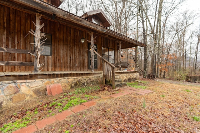 view of property exterior featuring a porch