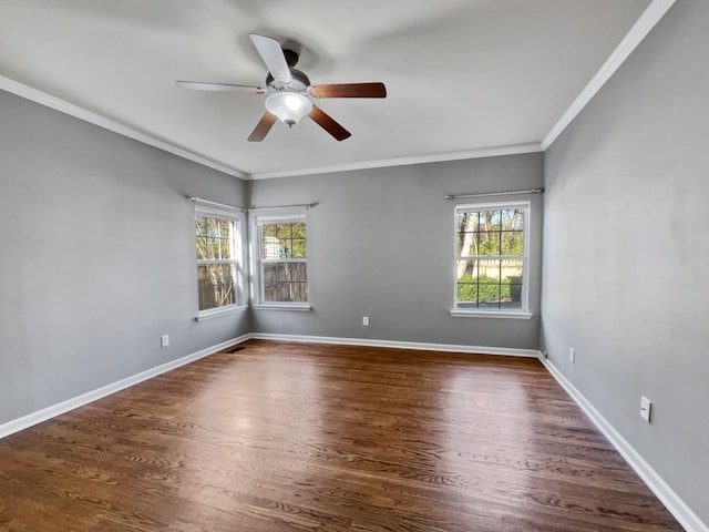 empty room featuring ceiling fan, dark hardwood / wood-style floors, and a healthy amount of sunlight