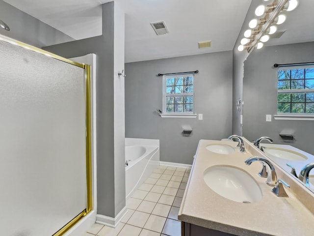 bathroom featuring plenty of natural light, tile floors, dual bowl vanity, and independent shower and bath