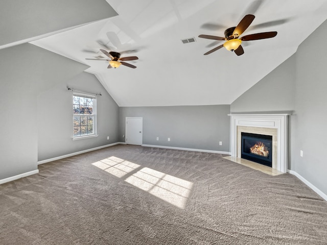 additional living space with light colored carpet, ceiling fan, and lofted ceiling