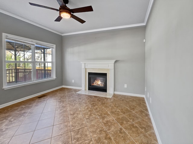 unfurnished living room featuring ceiling fan, light tile flooring, and ornamental molding