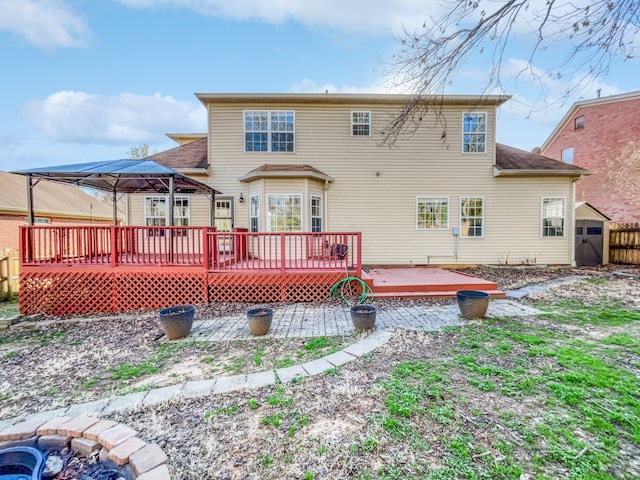 back of property with a wooden deck