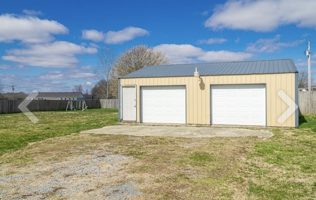 garage featuring a lawn