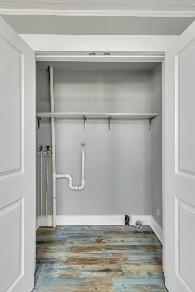 washroom featuring hookup for a washing machine and hardwood / wood-style floors