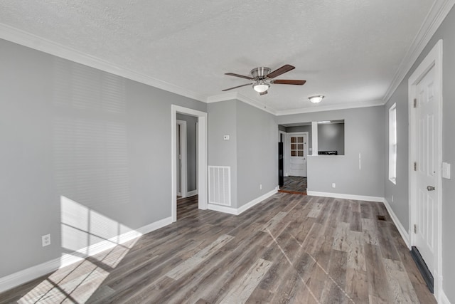 unfurnished room featuring ceiling fan, crown molding, dark hardwood / wood-style floors, and a textured ceiling