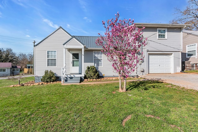 view of front property featuring a front yard and a garage