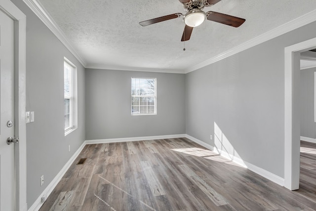 unfurnished room with ceiling fan, crown molding, and hardwood / wood-style floors