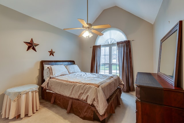 bedroom with ceiling fan, light colored carpet, and high vaulted ceiling