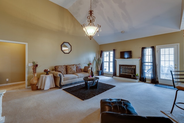 living room with high vaulted ceiling and light colored carpet