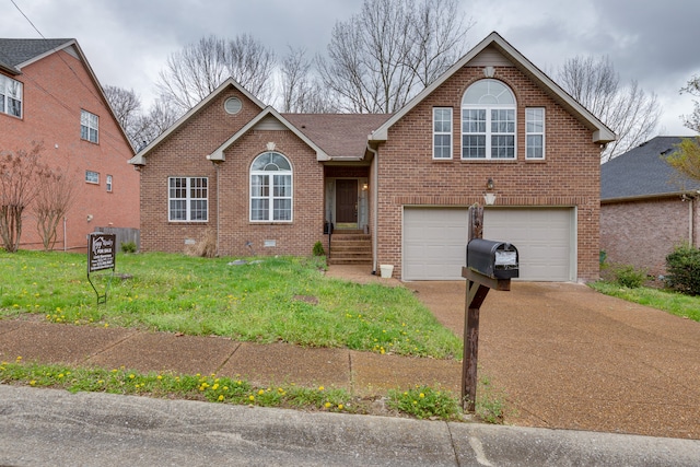 view of front of home with a front lawn and a garage