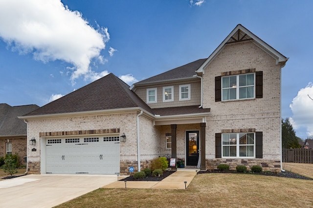 craftsman inspired home with a front yard and a garage